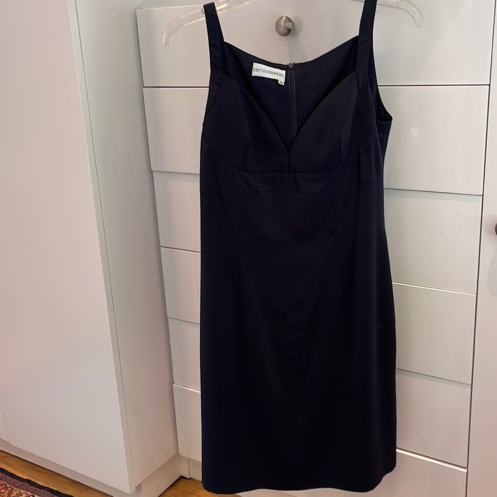 Figure flattering navy dress can be dressy or not.
